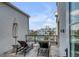 Relaxing balcony with lounge chairs overlooking the community pool and beautiful landscaping at 405 Spartina Ln # 405, Charleston, SC 29492