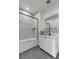 Clean bathroom with white cabinets, a shower-tub combo, and modern fixtures at 405 Spartina Ln # 405, Charleston, SC 29492