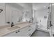 Bright bathroom with dual sinks, large mirror, step in shower, and a soaking tub at 405 Spartina Ln # 405, Charleston, SC 29492