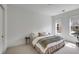 Bright bedroom with carpet, neutral linens, plus a sitting area near a window at 405 Spartina Ln # 405, Charleston, SC 29492