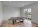Bright dining room features a rustic wooden table and chairs plus an outside view at 405 Spartina Ln # 405, Charleston, SC 29492