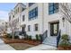 Elegant townhouse entrance with a welcoming porch, steps, and manicured shrubbery at 405 Spartina Ln # 405, Charleston, SC 29492