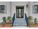 Elegant front door entrance with decorative trim, and brick exterior at 405 Spartina Ln # 405, Charleston, SC 29492