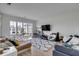 Cozy living room with large windows, hardwood floors, and stylish decor at 405 Spartina Ln # 405, Charleston, SC 29492