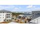 Charming street view featuring well-maintained buildings, palm trees and waterfront bridge in the background at 405 Spartina Ln # 405, Charleston, SC 29492