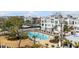 Beautiful community swimming pool with lounge chairs and surrounding well-manicured landscape, perfect for relaxation at 405 Spartina Ln # 405, Charleston, SC 29492