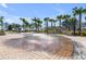 A splash pad surrounded by palm trees provides a great place to play and cool off at 405 Spartina Ln # 405, Charleston, SC 29492