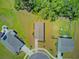 Aerial shot of a home showcases its landscaping, backyard space, and proximity to other homes in the cul-de-sac at 407 Spruce Ivy St, Moncks Corner, SC 29461