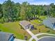 Charming single-Gathering home boasts a manicured lawn, fenced yard, and picturesque tree-lined backdrop at 407 Spruce Ivy St, Moncks Corner, SC 29461