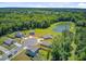Aerial view displays beautiful homes near a scenic pond, showcasing a harmonious blend of nature and community at 407 Spruce Ivy St, Moncks Corner, SC 29461