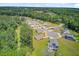 Community aerial features well-kept homes with lush lawns and is nestled within a tranquil, wooded landscape at 407 Spruce Ivy St, Moncks Corner, SC 29461