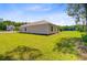 Expansive backyard of this home features lush green grass and a serene wooded backdrop, perfect for outdoor enjoyment at 407 Spruce Ivy St, Moncks Corner, SC 29461