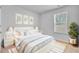 Stylish bedroom with a cozy bed, soft lighting, and elegant décor at 407 Spruce Ivy St, Moncks Corner, SC 29461