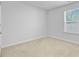 Neutral bedroom featuring carpeted floors, a window for natural light, and a closet at 407 Spruce Ivy St, Moncks Corner, SC 29461