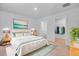Bright bedroom featuring a serene decor, wood nightstands, and a walk-in closet for ample storage at 407 Spruce Ivy St, Moncks Corner, SC 29461