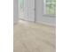 A view of the beige carpet and the sunlight streaming in through the windows at 407 Spruce Ivy St, Moncks Corner, SC 29461