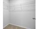 Walk-in closet features wire shelving on the walls and beige carpet flooring at 407 Spruce Ivy St, Moncks Corner, SC 29461