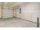 Spacious unfinished two-car garage with concrete floors and an automatic door at 407 Spruce Ivy St, Moncks Corner, SC 29461