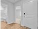Bright, modern hallway with wood-look flooring and visible bathroom and bedroom entrances at 407 Spruce Ivy St, Moncks Corner, SC 29461
