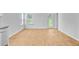 Spacious living area with wood floors, natural light, and access to outdoor space at 407 Spruce Ivy St, Moncks Corner, SC 29461