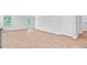 Open-concept living space with wood floors, large window, and access to back patio at 407 Spruce Ivy St, Moncks Corner, SC 29461