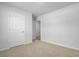 This room features beige carpeting and a closet with an open door at 407 Spruce Ivy St, Moncks Corner, SC 29461