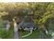 Aerial view of home with mature trees and lush landscape, providing a private and serene setting at 408 N Palmetto St, Summerville, SC 29483