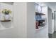 This kitchen nook has blue patterned wallpaper and decorative shelves for storage and displaying items at 408 N Palmetto St, Summerville, SC 29483