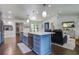 Open concept kitchen, dining, and living room featuring an island, and stainless appliances at 408 N Palmetto St, Summerville, SC 29483