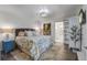 Bright bedroom with a large bed, modern lighting, and stylish décor at 408 N Palmetto St, Summerville, SC 29483