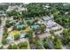 Aerial view of the community's tennis courts and pool surrounded by mature trees at 408 N Palmetto St, Summerville, SC 29483