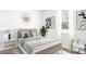 Bright bedroom featuring neutral decor, a comfortable bed, and elegant furnishings for a relaxing retreat at 414 Mistflower Ln, Moncks Corner, SC 29461