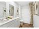 Bright bathroom with dual sinks, bathtub and shower combination, and stylish decor at 415 Mistflower Ln, Moncks Corner, SC 29461