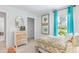 Bright bedroom featuring a modern dresser, patterned bedding and ample natural light at 415 Mistflower Ln, Moncks Corner, SC 29461