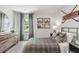 Charming bedroom with a gray plaid bed set, dark wood furniture and ample natural light at 415 Mistflower Ln, Moncks Corner, SC 29461