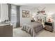 Charming bedroom featuring a gray plaid bed set, hockey themed decor and modern furniture at 415 Mistflower Ln, Moncks Corner, SC 29461