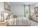 Serene bedroom featuring neutral decor, plush bedding, and abundant natural light for a restful retreat at 415 Mistflower Ln, Moncks Corner, SC 29461