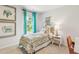 Cozy bedroom with turquoise curtains, light neutral walls, and a beautiful patterned bed set at 415 Mistflower Ln, Moncks Corner, SC 29461