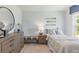Charming bedroom with nautical themed decor and a large window at 415 Mistflower Ln, Moncks Corner, SC 29461