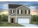 New two-story home with black shutters, a gray exterior, a two-car garage, and manicured landscaping at 415 Mistflower Ln, Moncks Corner, SC 29461