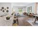 Bright, open living space with wood floors, modern furnishings, and sliding glass doors to bring the outdoors in at 415 Mistflower Ln, Moncks Corner, SC 29461