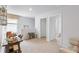 Bright open-concept living space with neutral walls and plush carpet flooring at 415 Mistflower Ln, Moncks Corner, SC 29461