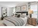 Well-appointed main bedroom with a full length mirror and ample natural light at 415 Mistflower Ln, Moncks Corner, SC 29461