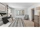 Comfortable main bedroom featuring decorative wall art and neutral-toned furnishings at 415 Mistflower Ln, Moncks Corner, SC 29461