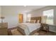 Cozy bedroom with plush rug, bedside tables and lamps, and lots of natural light at 416 Mistflower Ln, Moncks Corner, SC 29461