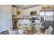 Bright kitchen featuring stainless steel appliances, white cabinets, and a glass dining table for a modern, inviting space at 416 Mistflower Ln, Moncks Corner, SC 29461