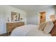 Serene bedroom with a decorative dresser, artwork, and plush bedding at 416 Mistflower Ln, Moncks Corner, SC 29461