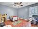Cozy bedroom with wood floors, blue walls, natural light, and space for a playroom at 4662 Nibbs Ln, North Charleston, SC 29418