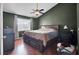 Spacious bedroom with ceiling fan and large window at 4662 Nibbs Ln, North Charleston, SC 29418