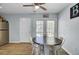 Cozy dining area with a round table, ceiling fan, and access to outdoor space through glass doors at 4662 Nibbs Ln, North Charleston, SC 29418